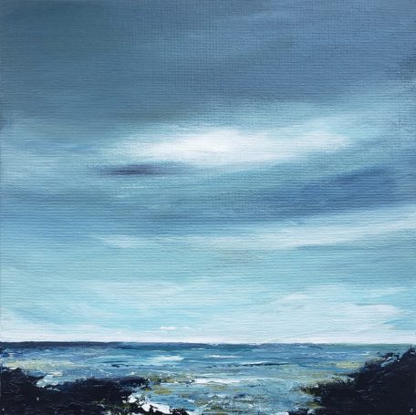 Square blue seascape over a rocky shore